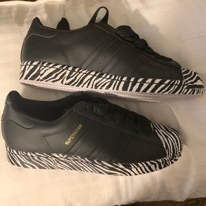 Brand new black and white zebra print as adidas’s. Women size 9